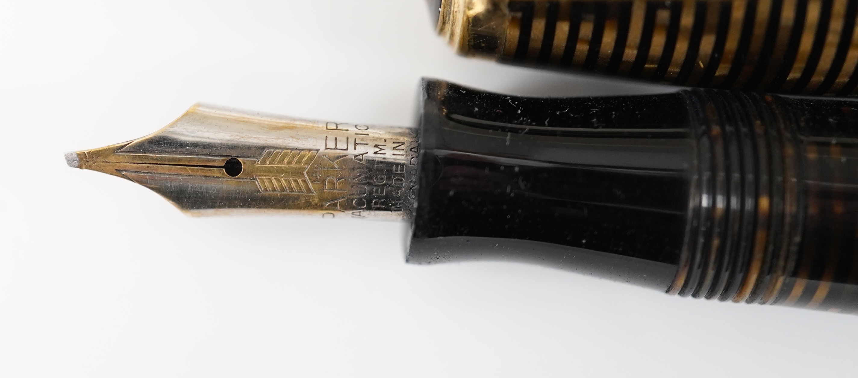 A Parker Vacumatic in brown with rare wide cap band